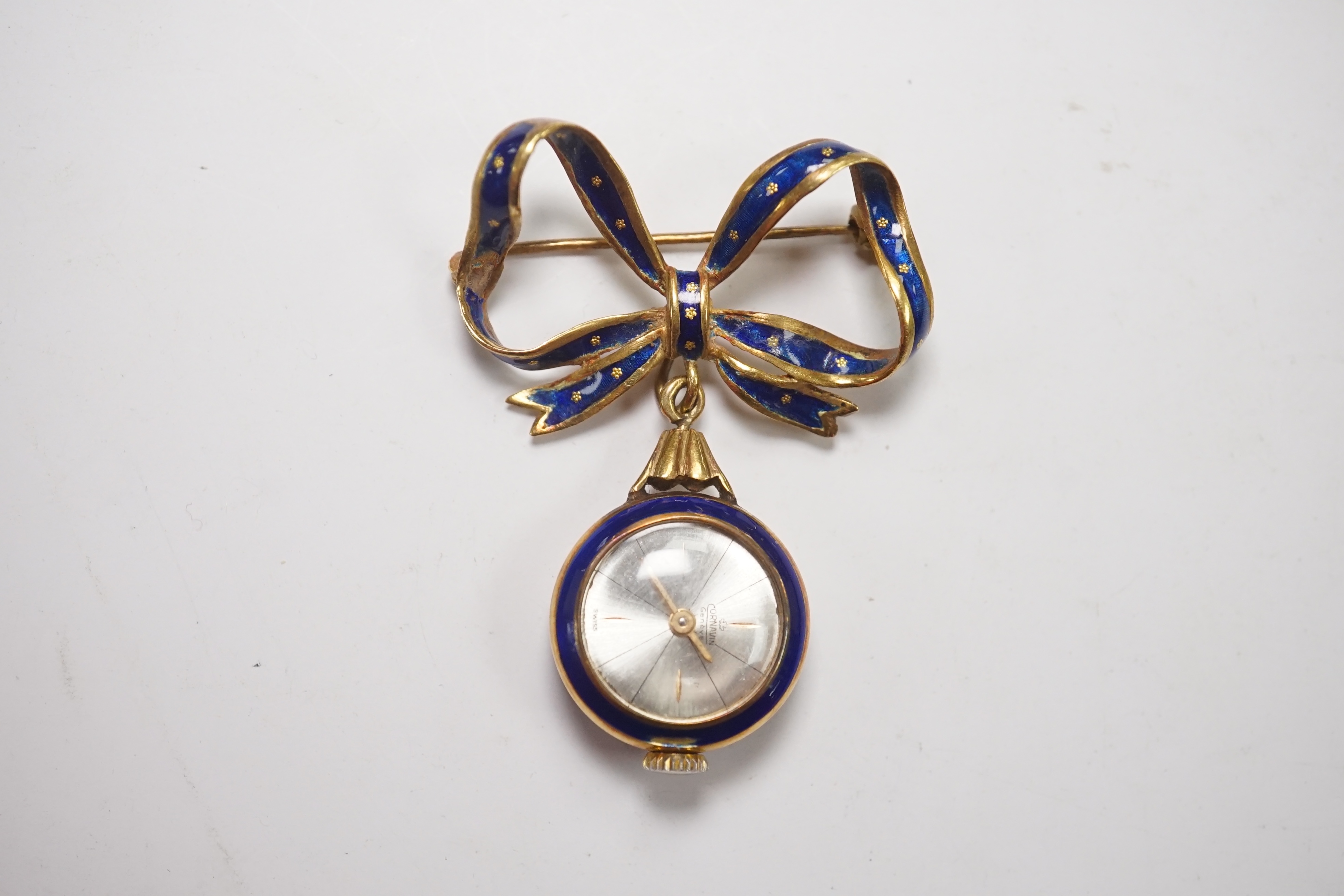 A mid 20th century Italian 750 and blue enamel fob watch, on a ribbon bow suspension brooch, overall drop 42mm, gross 10.9 grams. Condition - poor to fair